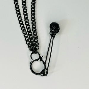 Connective chain earrings with ear cuff and skull safety pin drop